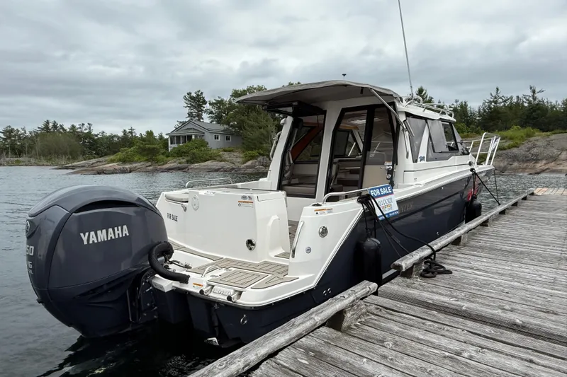  Yacht Photos Pics 2023 Cutwater C-248 Coupe boat docked, featuring Yamaha outboard motor, for sale sign visible.