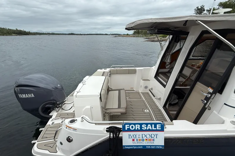  Yacht Photos Pics 2023 Cutwater C-248 Coupe boat for sale, featuring Yamaha outboard motor, docked on a serene lake.