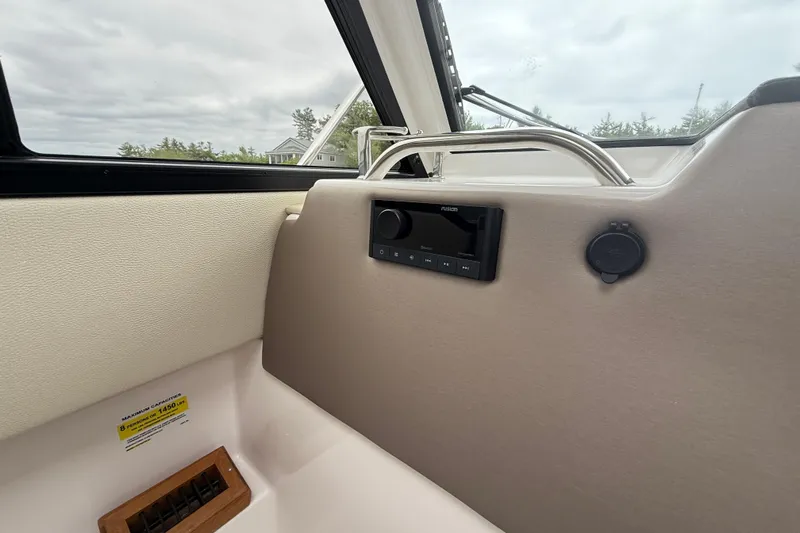  Yacht Photos Pics Interior of 2023 Cutwater C-248 Coupe boat with audio system and capacity label.