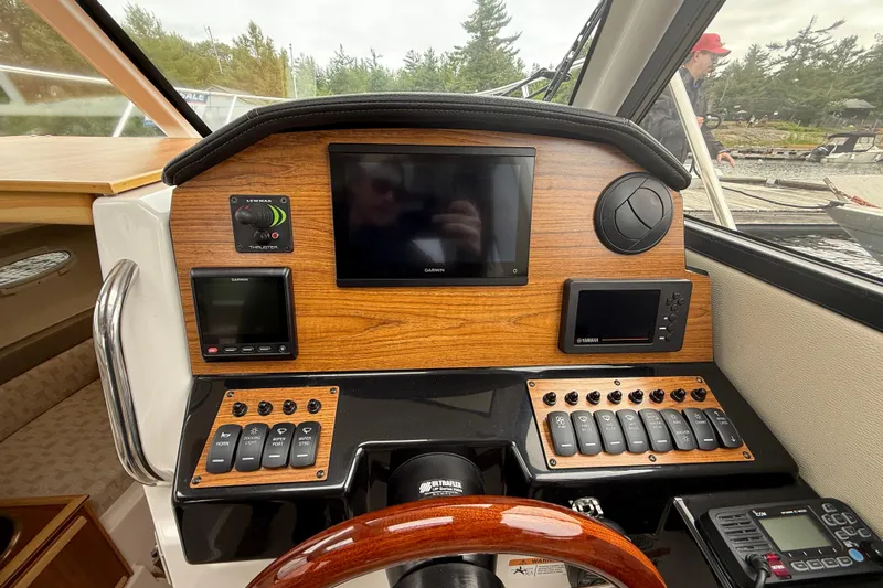  Yacht Photos Pics 2023 Cutwater C-248 Coupe dashboard with navigation screens and control panels.