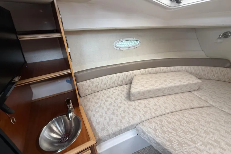  Yacht Photos Pics 2023 Cutwater C-248 Coupe interior with cozy seating and compact sink.