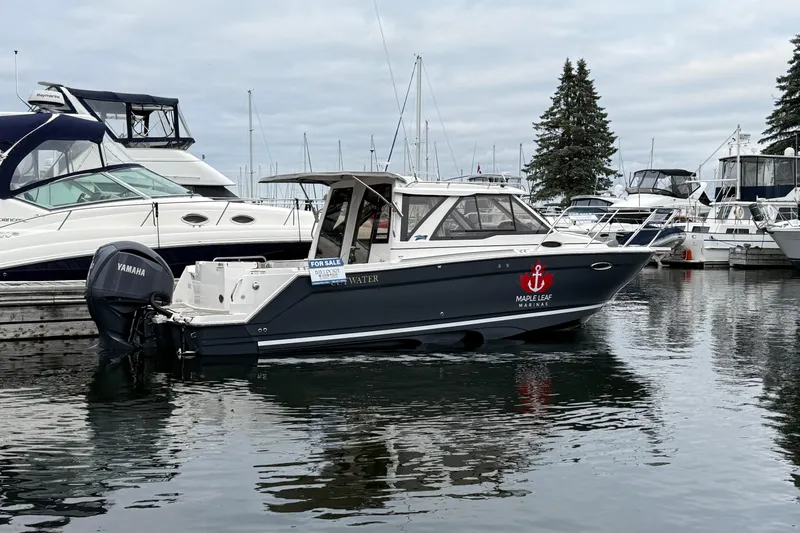  Yacht Photos Pics 2023 Cutwater C-248 Coupe boat docked at marina, for sale sign visible.