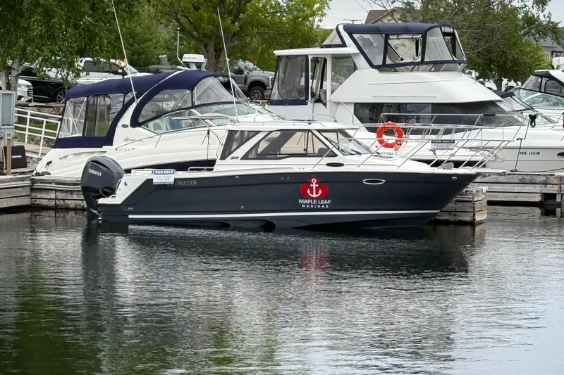  Yacht Photos Pics 2023 Cutwater C-248 Coupe boat docked at marina, featuring Maple Leaf Marinas logo.