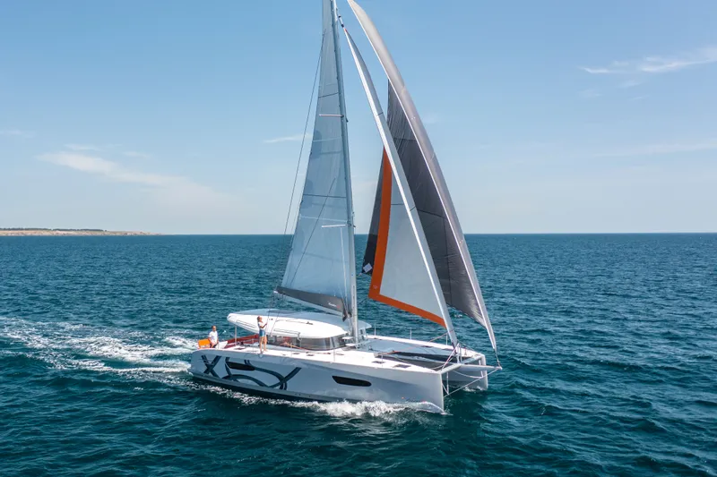Tbd Yacht Photos Pics 2026 Excess 14 catamaran sailing on open sea.