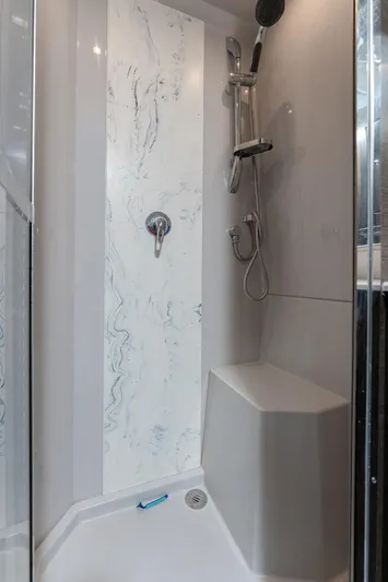 Lil' Darlin' Yacht Photos Pics Shower area in 2018 Cruisers Yachts 50 Cantius with modern fixtures and seating.