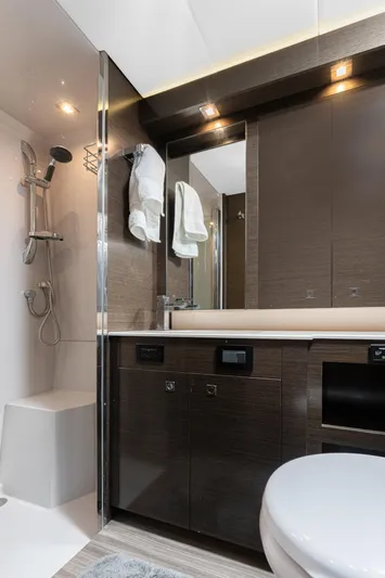 Lil' Darlin' Yacht Photos Pics Luxurious bathroom in 2018 Cruisers Yachts 50 Cantius with modern fixtures and sleek design.