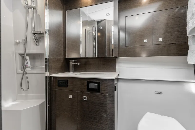 Lil' Darlin' Yacht Photos Pics Luxurious bathroom in 2018 Cruisers Yachts 50 Cantius with modern fixtures and sleek design.