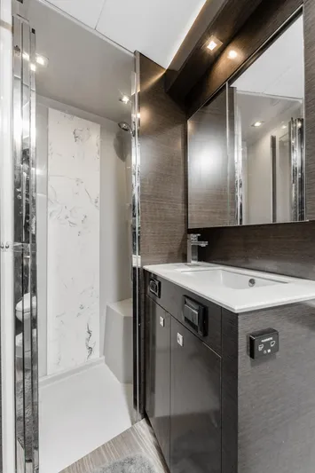 Lil' Darlin' Yacht Photos Pics Luxurious bathroom in 2018 Cruisers Yachts 50 Cantius with modern fixtures and sleek design.