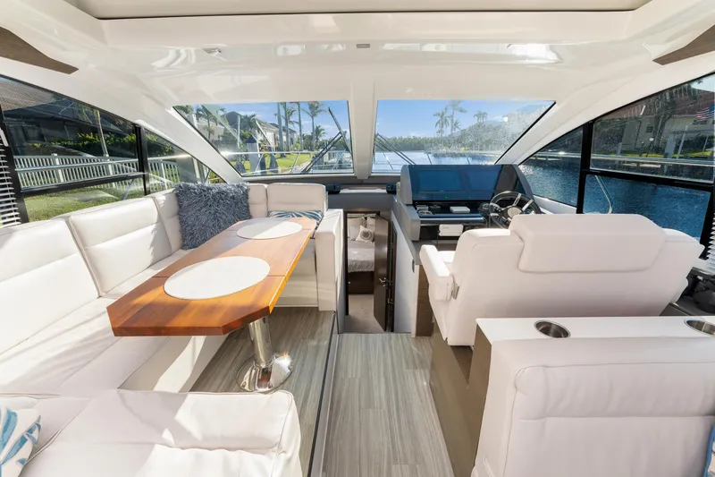 Lil' Darlin' Yacht Photos Pics Luxurious interior of 2018 Cruisers Yachts 50 Cantius with elegant seating and helm.