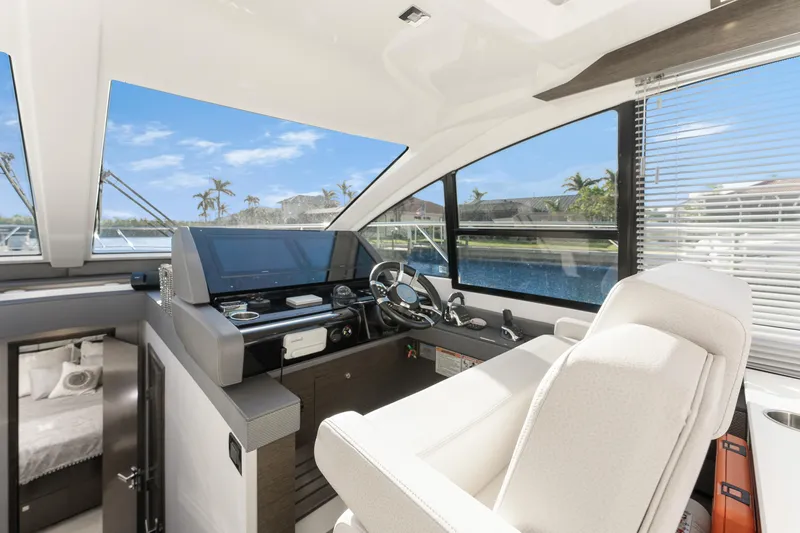 Lil' Darlin' Yacht Photos Pics Luxurious 2018 Cruisers Yachts 50 Cantius helm with modern controls and panoramic windows.
