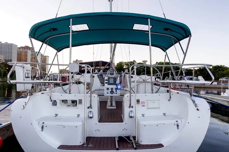 Alize Yacht Photos Pics Stern view of a 1999 Catalina 400 sailboat docked at a marina.