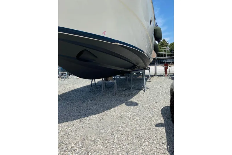  Yacht Photos Pics 2002 Ferretti Yachts 430 on stands, gravel lot, sunny day, side view.