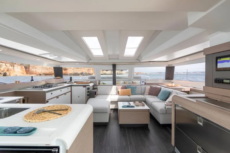  Yacht Photos Pics Luxurious interior of 2024 Fountaine Pajot Catamaran Elba 45 with modern furnishings and panoramic windows.