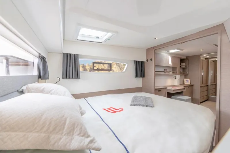  Yacht Photos Pics Luxurious bedroom interior of 2024 Fountaine Pajot Catamaran Elba 45 with modern design.