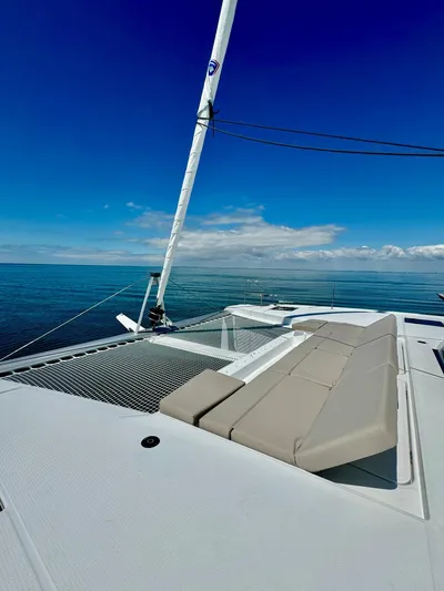  Yacht Photos Pics 2024 Fountaine Pajot Catamaran Elba 45 on calm sea under clear blue sky.