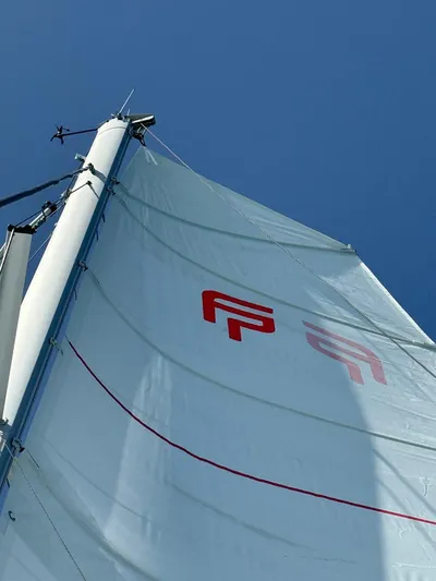  Yacht Photos Pics Sail of 2024 Fountaine Pajot Catamaran Elba 45 against clear blue sky.