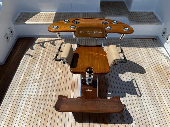 Gryphon Yacht Photos Pics Luxurious 2002 Custom Carolina Ritchie Howell yacht deck with polished wood fighting chair.