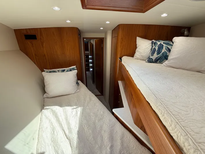 Gryphon Yacht Photos Pics Interior of 2002 Custom Carolina Ritchie Howell yacht with cozy twin beds and wooden finish.
