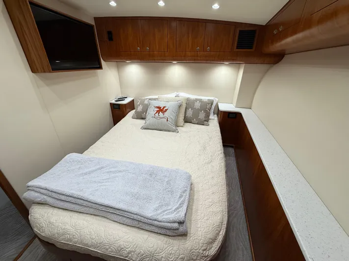 Gryphon Yacht Photos Pics Luxurious cabin interior of a 2002 Custom Carolina Ritchie Howell yacht with cozy bedding.