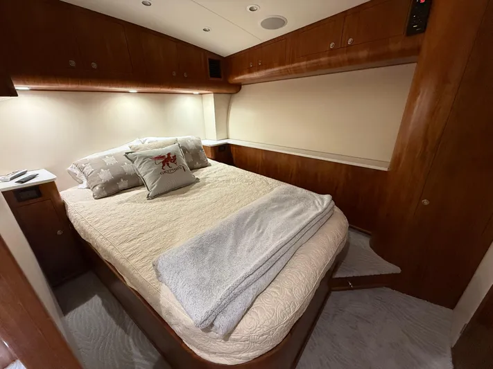 Gryphon Yacht Photos Pics Luxurious cabin interior of 2002 Custom Carolina Ritchie Howell yacht with cozy bedding.