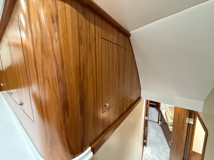 Gryphon Yacht Photos Pics Interior of 2002 Custom Carolina Ritchie Howell yacht with polished wood paneling.