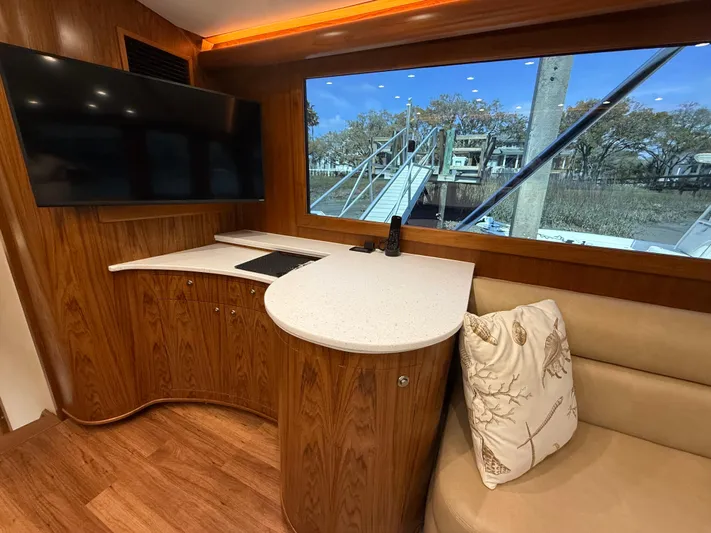 Gryphon Yacht Photos Pics Luxurious 2002 Custom Carolina Ritchie Howell yacht interior with wood finish and large window view.