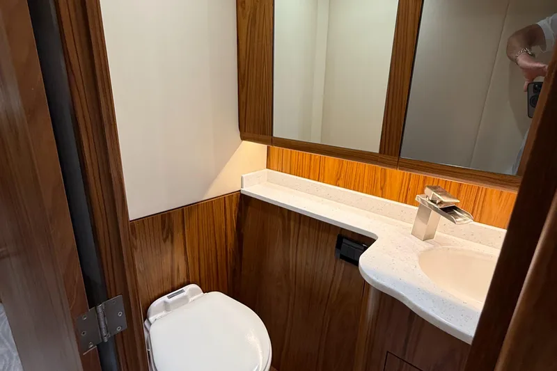 Gryphon Yacht Photos Pics Luxurious 2002 Custom Carolina Ritchie Howell yacht bathroom with wood accents and modern fixtures.