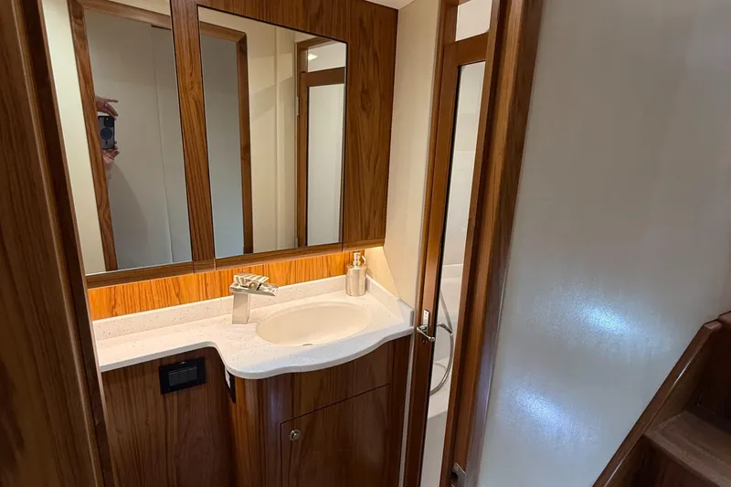 Gryphon Yacht Photos Pics Luxurious 2002 Custom Carolina Ritchie Howell yacht bathroom with wood accents and modern fixtures.