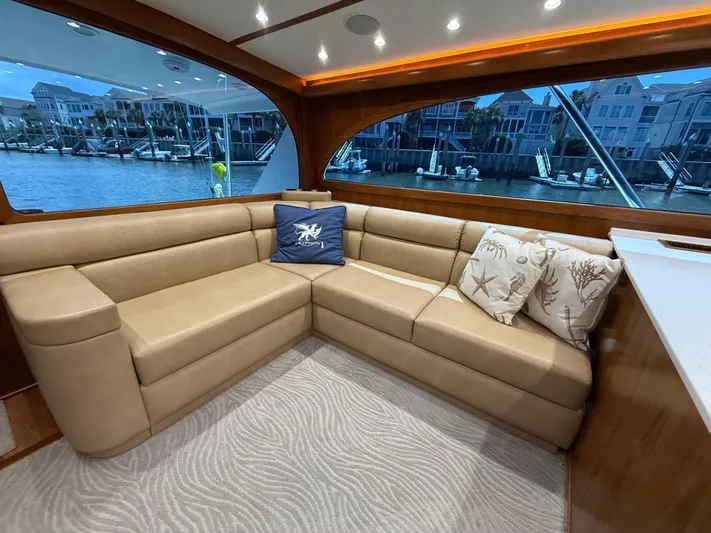 Gryphon Yacht Photos Pics Luxurious interior of 2002 Custom Carolina Ritchie Howell yacht with beige leather seating.