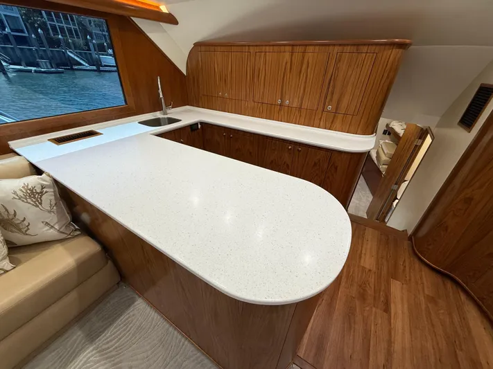 Gryphon Yacht Photos Pics Luxurious 2002 Custom Carolina Ritchie Howell yacht interior with modern kitchen and elegant wood finishes.