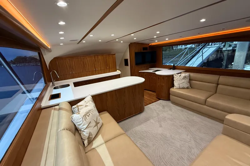Gryphon Yacht Photos Pics Luxurious interior of 2002 Custom Carolina Ritchie Howell yacht with modern seating and kitchen area.