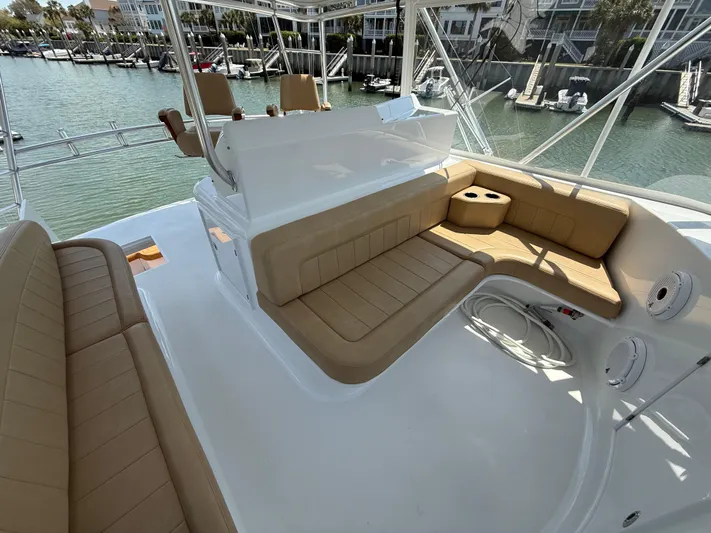 Gryphon Yacht Photos Pics Luxurious seating area on 2002 Custom Carolina Ritchie Howell boat, docked in a marina.