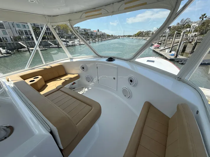 Gryphon Yacht Photos Pics Luxurious 2002 Custom Carolina Ritchie Howell boat interior with tan seating and waterfront view.