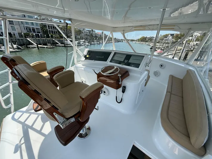 Gryphon Yacht Photos Pics 2002 Custom Carolina Ritchie Howell boat helm with luxurious seating and modern controls.