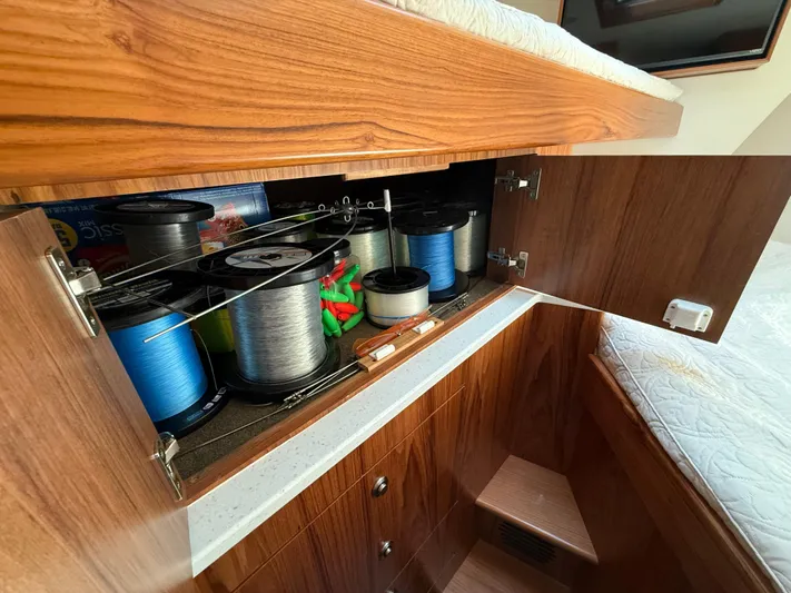 Gryphon Yacht Photos Pics Cabinet in 2002 Custom Carolina Ritchie Howell boat storing fishing lines and supplies.