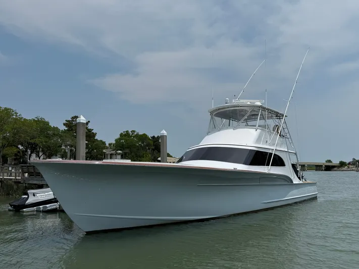 Gryphon Yacht Photos Pics 2002 Custom Carolina Ritchie Howell yacht docked on a calm waterway.