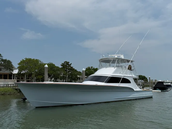 Gryphon Yacht Photos Pics 2002 Custom Carolina Ritchie Howell yacht docked in a serene marina setting.
