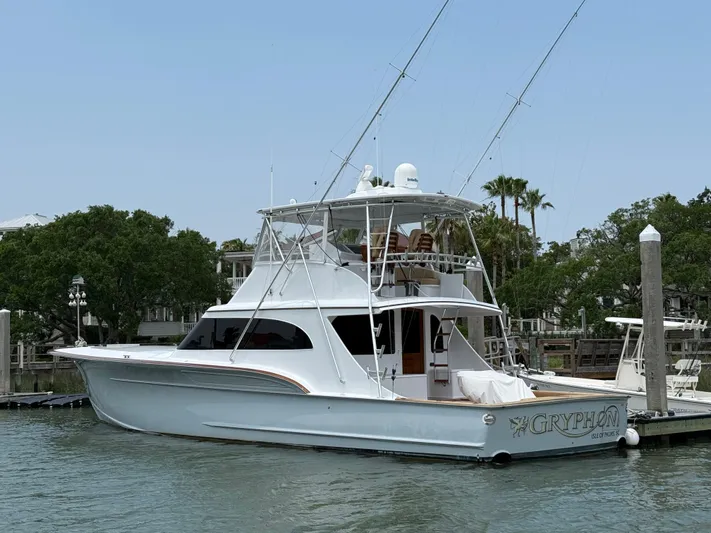 Gryphon Yacht Photos Pics 2002 Custom Carolina Ritchie Howell yacht docked, featuring sleek design and spacious deck.