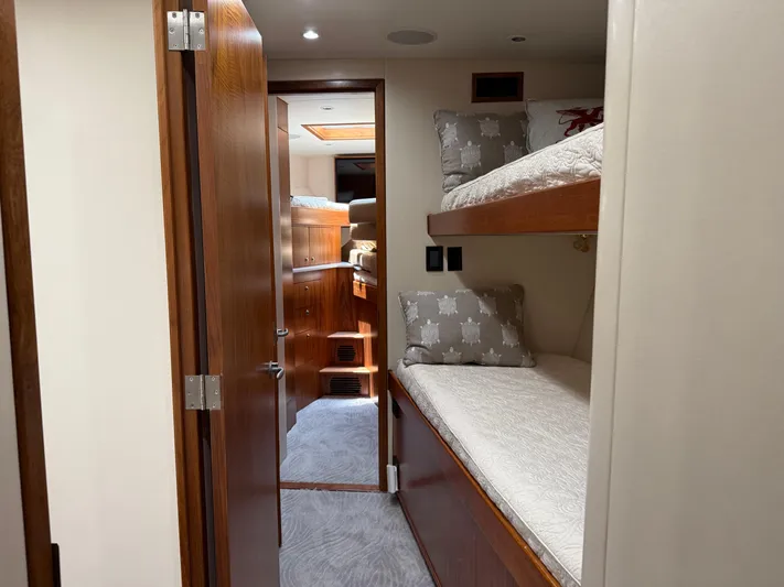 Gryphon Yacht Photos Pics Interior of 2002 Custom Carolina Ritchie Howell yacht with cozy bunk beds and wooden finishes.