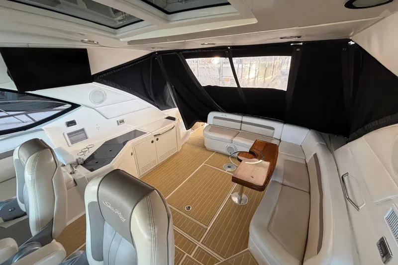  Yacht Photos Pics Luxurious interior of 2014 Sea Ray 540 Sundancer yacht with elegant seating and wood accents.