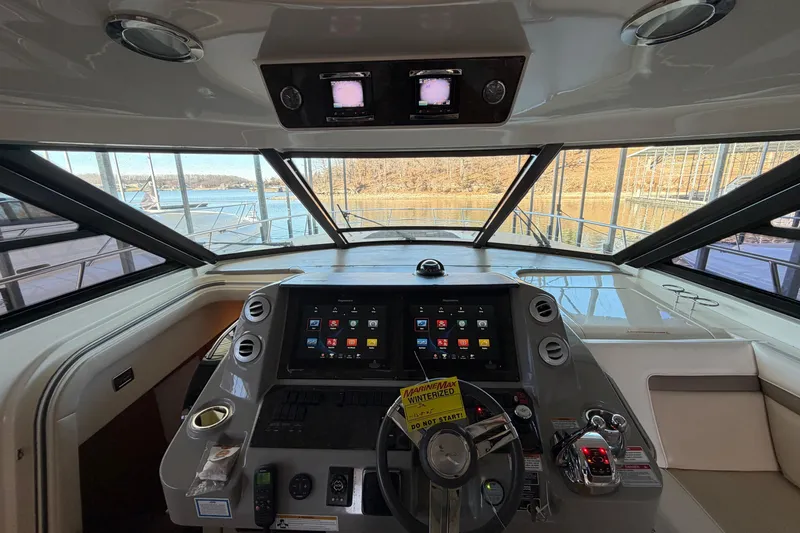  Yacht Photos Pics 2014 Sea Ray 540 Sundancer helm with advanced navigation system and panoramic windows.