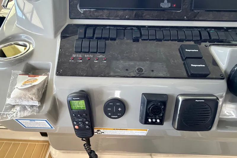  Yacht Photos Pics Control panel of a 2014 Sea Ray 540 Sundancer with navigation and communication equipment.