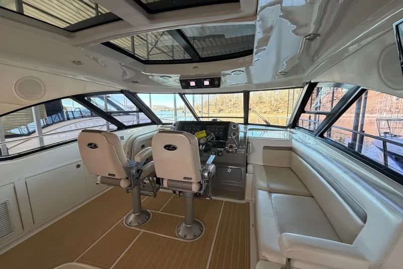  Yacht Photos Pics Interior of 2014 Sea Ray 540 Sundancer yacht with helm and seating area.
