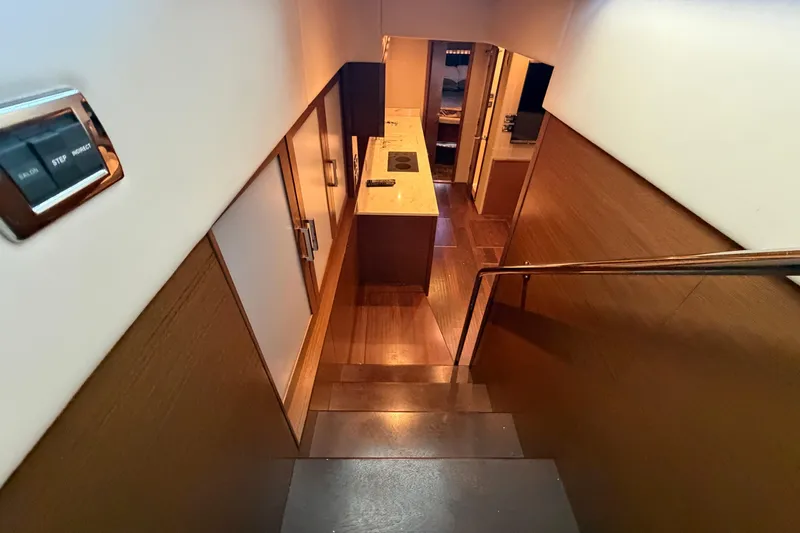  Yacht Photos Pics Interior view of 2014 Sea Ray 540 Sundancer yacht, featuring modern staircase and sleek design.