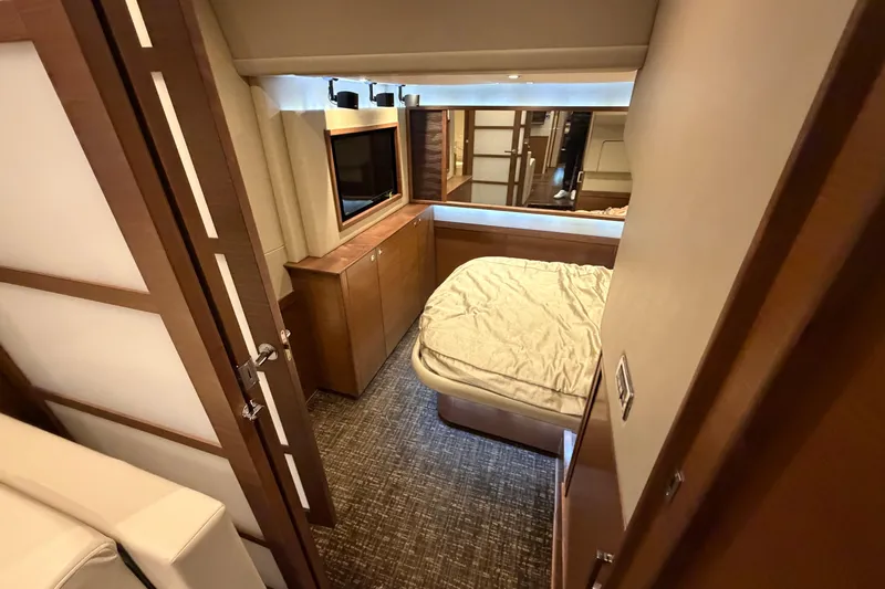  Yacht Photos Pics Luxurious cabin interior of 2014 Sea Ray 540 Sundancer yacht with bed and TV.