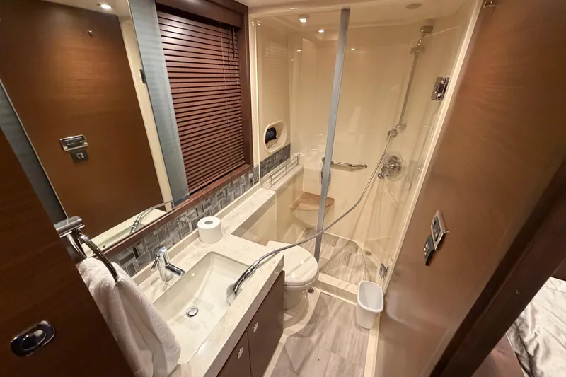  Yacht Photos Pics Luxurious bathroom in 2014 Sea Ray 540 Sundancer yacht with modern fixtures and shower.