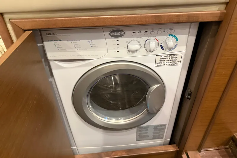  Yacht Photos Pics Splendide washer in 2014 Sea Ray 540 Sundancer yacht, wooden cabinet open.