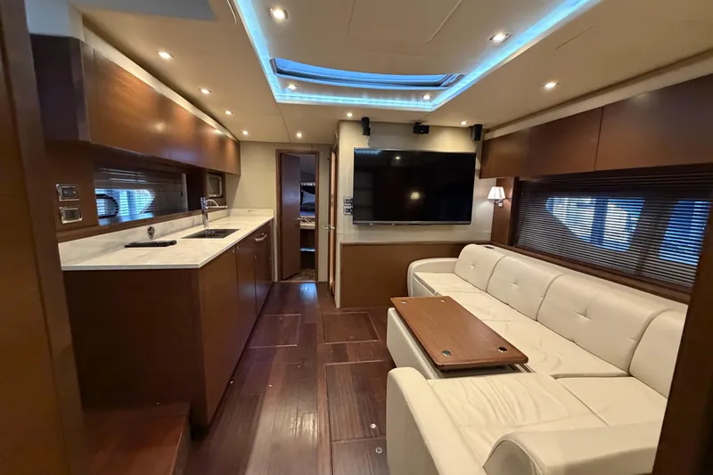  Yacht Photos Pics Luxurious interior of 2014 Sea Ray 540 Sundancer yacht with modern amenities and elegant design.