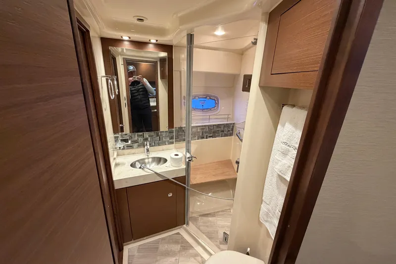 Yacht Photos Pics Luxurious bathroom interior of 2014 Sea Ray 540 Sundancer yacht with modern fixtures.