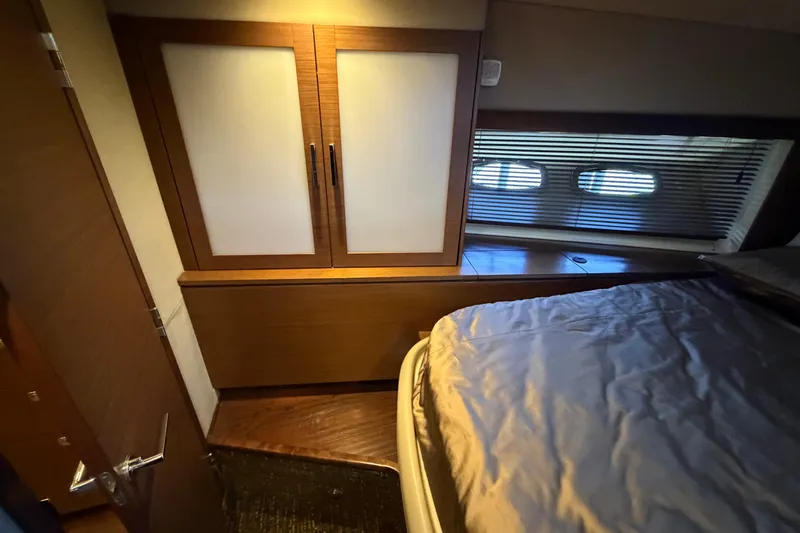  Yacht Photos Pics Luxurious cabin interior of 2014 Sea Ray 540 Sundancer yacht with bed and storage.